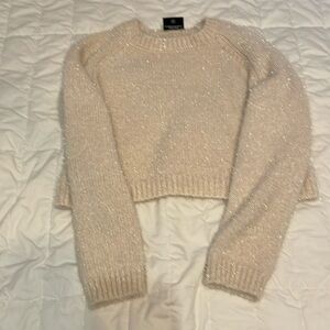 Cropped sweater. 75% polyester 25% nylon. Boutique store brand Miou Muse.